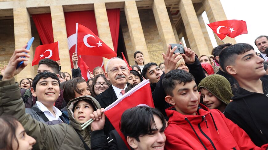 Kemal Kilicdaroglu (C), Chairman of the Republican People's Party (CHP) and presidential candidate, takes pictures with children outside the Anitkabir at the Mausoleum of founder of the Turkish Republic Mustafa Kemal Ataturk, during the celebration marking the 103th anniversary of the foundation of Grand National Assembly, National Sovereignty and Children's Day in Ankara, on April 23, 2023. (Photo by Adem ALTAN / AFP) (Photo by ADEM ALTAN/AFP via Getty Images)