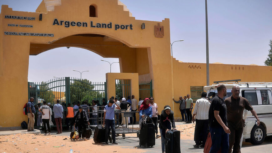 Refugees cross into Egypt through the Argeen land port with Sudan, April 27, 2023.