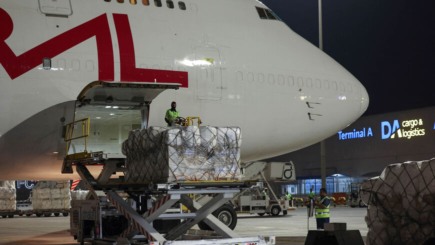 A relief cargo slated for war-ridden Sudan is loaded onto an airplane in Dubai, May 8, 2023.