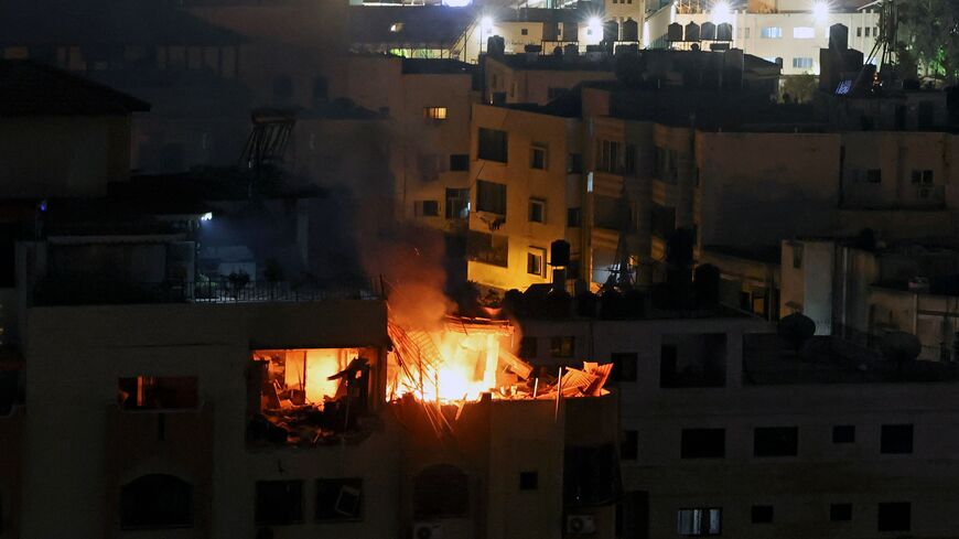  A fire breaks out at an apartment following an explosion in Gaza City, Palestinian Territories on May 9, 2023. - Nine people were killed May 9, 2023 before dawn in Israeli air strikes on the Gaza Strip, according to the Health Ministry of this territory under the control of the Palestinian Islamist movement Hamas. (Photo by MOHAMMED ABED / AFP) (Photo by MOHAMMED ABED/AFP via Getty Images)