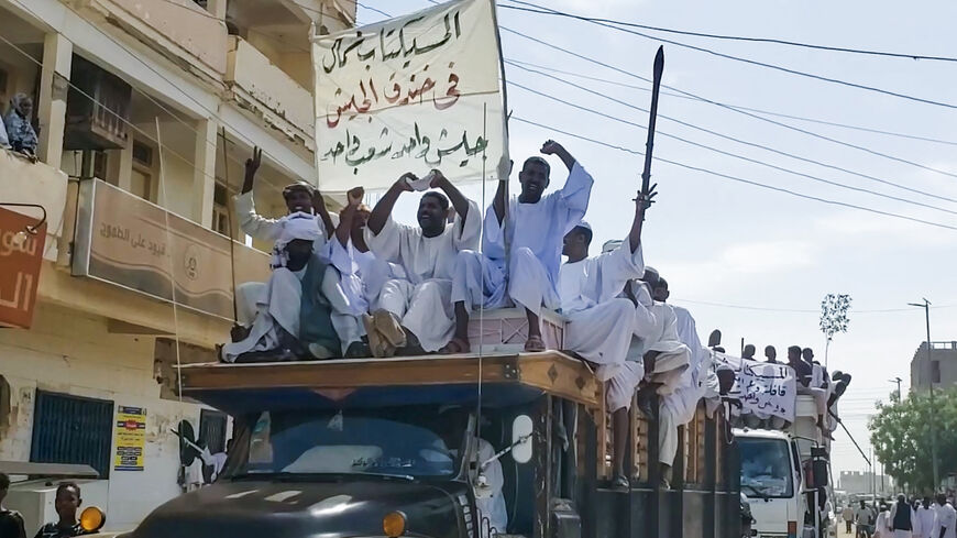 People form a convoy as they celebrate in support of the Sudanese armed forces in Khartoum on May 12, 2023.