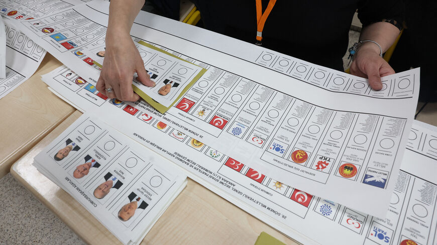 Election workers prepare ballots at a polling station in Ankara on May 14, 2023.