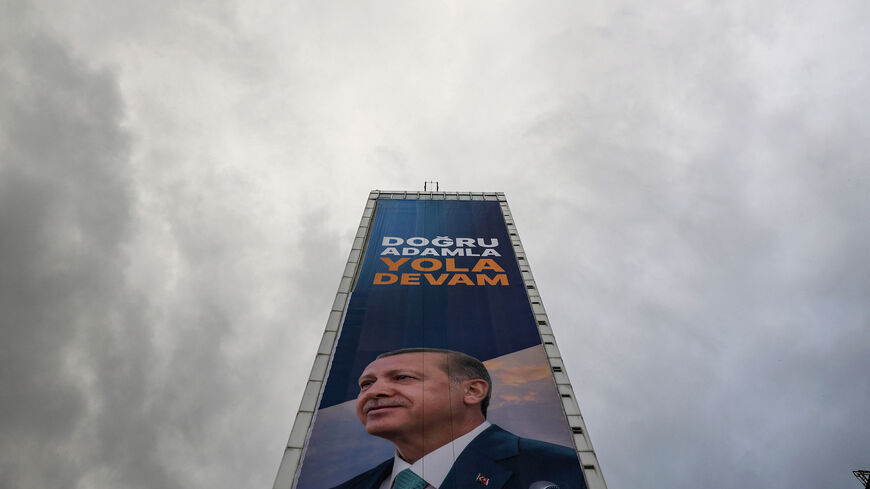 TOPSHOT - A huge electoral poster bearing a portrait of Turkish President and presidential candidate of AK Party Recep Tayyip Erdogan with a slogan which reads "Keep going with the right man" covers the facade of a high-rise building in Ankara, on May 23, 2023, ahead of the presidential election runoff on May 28, 2023. (Photo by Adem ALTAN / AFP) (Photo by ADEM ALTAN/AFP via Getty Images)