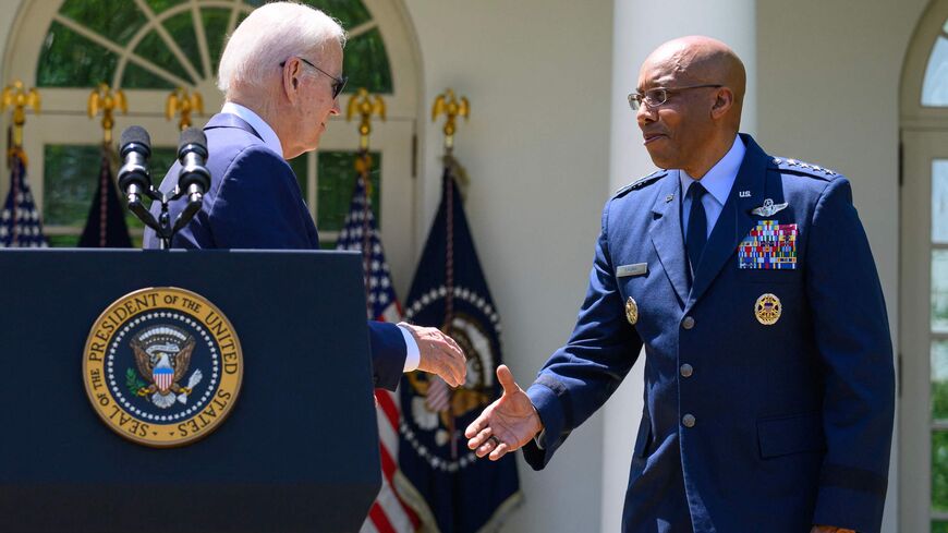 US President Joe Biden shakes hands with Air Force General Charles Brown, Jr. (R), after nominating him to serve as the next Chairman of the Joint Chiefs of Staff, in the Rose Garden of the White House in Washington, DC, May 25, 2023. 