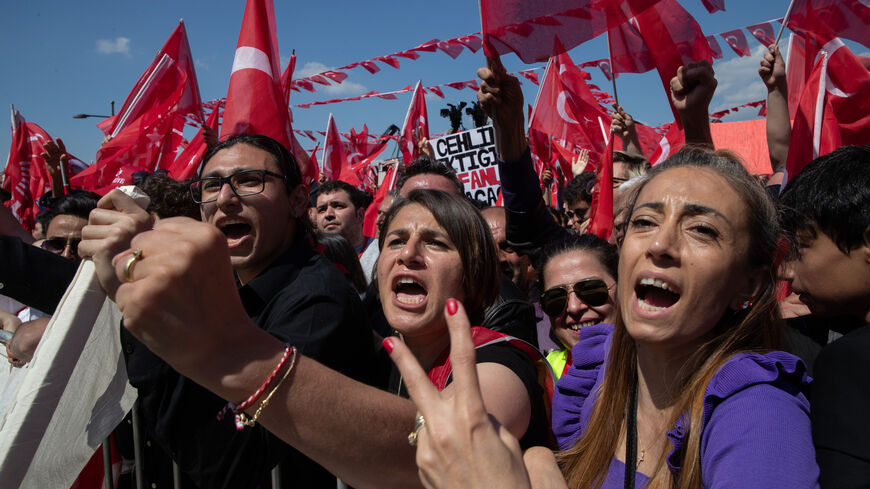 Supporters wave flags and chant slogans while waiting for the arrival of CHP Party presidential candidate Kemal Kilicdaroglu during a campaign rally on April 30, 2023 in Izmir, Turkey.