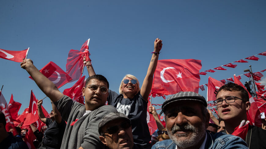 Supporters wave flags and chant slogans while waiting for the arrival of CHP Party presidential candidate Kemal Kilicdaroglu during a campaign rally on April 30, 2023 in Izmir, Turkey. CHP leader Kemal Kilicdaroglu is holding campaign rallies across Turkey ahead of the countries May 14, 2023 presidential and parliamentary elections. The Kilicdaroglu-led Nation Alliance is representing six opposition parties in next month's election against President Recep Tayyip Erdogan's 20-year rule. (Photo by Burak Kara/