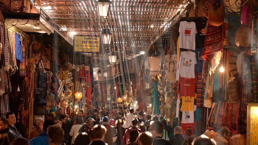 People walk through an alley of a traditional souk in the old Medina of Marrakesh on Dec. 30, 2014.