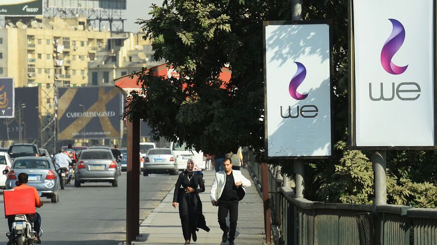 A picture taken on Oct. 31, 2017, shows advertising billboards in Cairo for "WE," a new mobile service from Egypt's state-owned company Telecom Egypt. 
