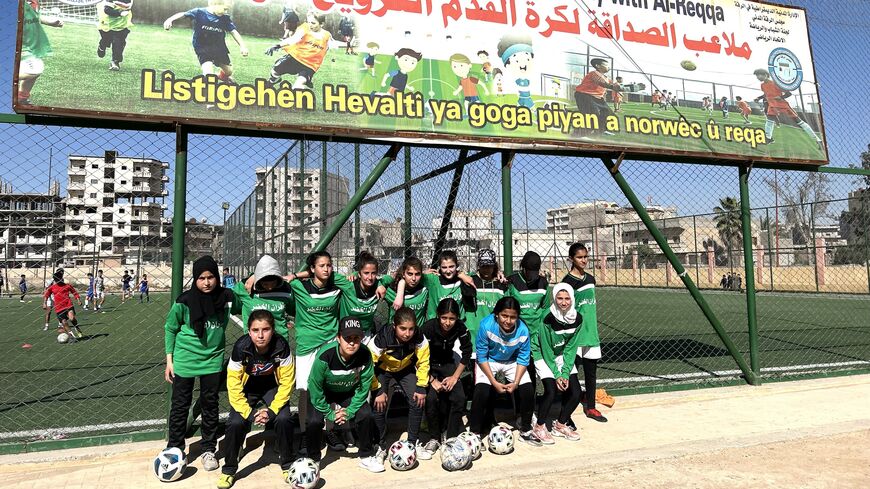 Raqqa’s first ever girls’ soccer team poses outside a pitch funded by Norwegian donors, April 25, 2023.
