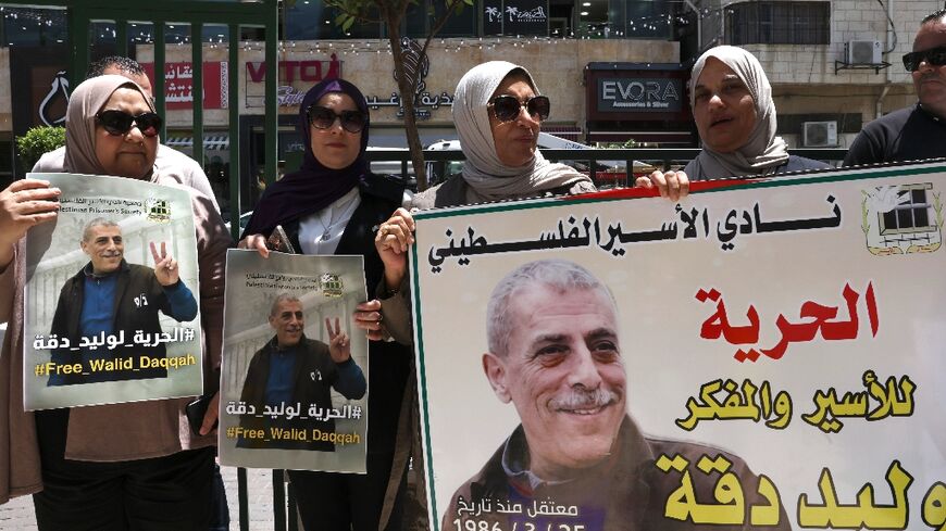 Supporters of Walid Daqqa, a Palestinian jailed for decades for the kidnap and murder of an Israeli soldier, rally for his early release on medical grounds