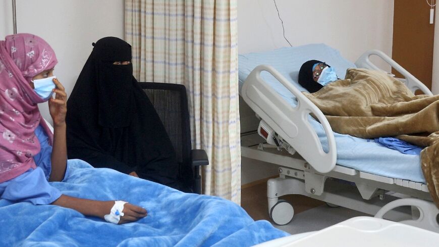 Relatives visit patients during the inauguration of a refurbished hospital in Aden on May 10, 2023