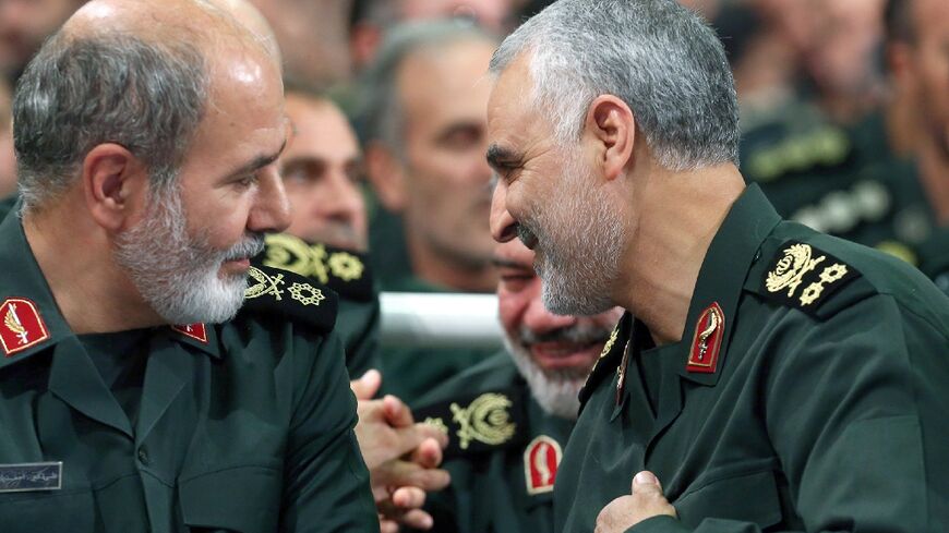 Ali Akbar Ahmadian (L) speaking with slain IRGC General Qasem Soleimani in Tehran