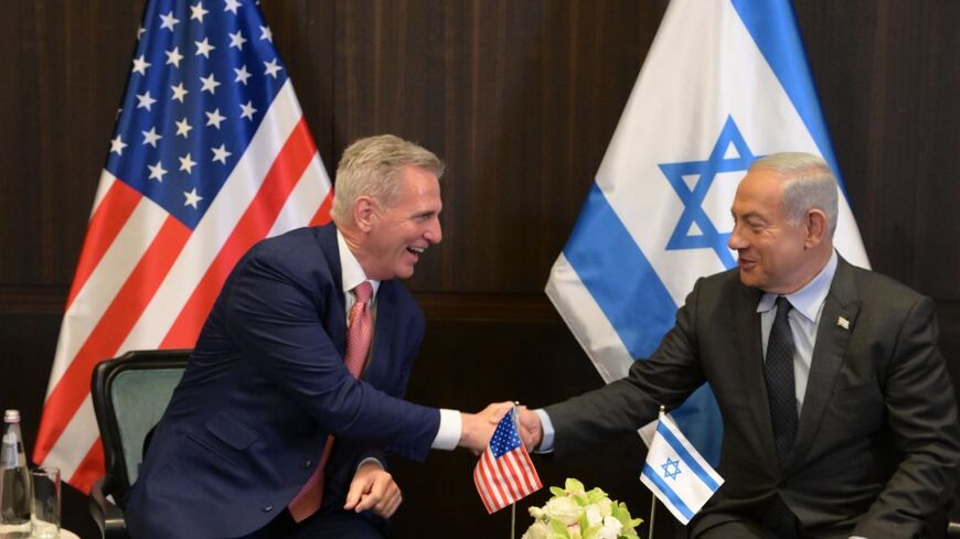  In this handout image provided by the Israeli Government Press Office (GPO), Israeli Prime Minister Benjamin Netanyahu shakes hands with US Congressman Kevin McCarthy (L) at the Prime Minister's office on
