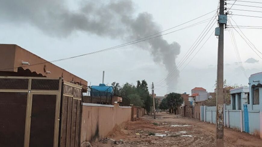 Smoke billows in the distance during ongoing fighting in Khartoum