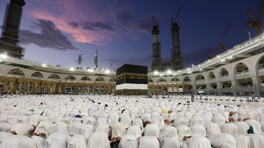 Muslim pilgrims perform prayers around the Kaaba, Islam's holiest site, at the Grand Mosque in the Saudi holy city of Mecca ahead of the hajj pilgrimage