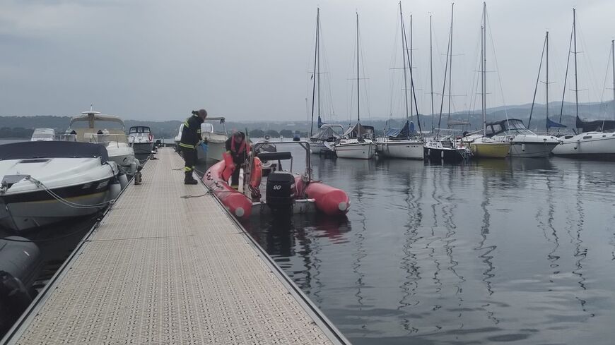 Rescuers prepare to search following a capsized boat at Lake Maggiore, Italy, May 29, 2023.
