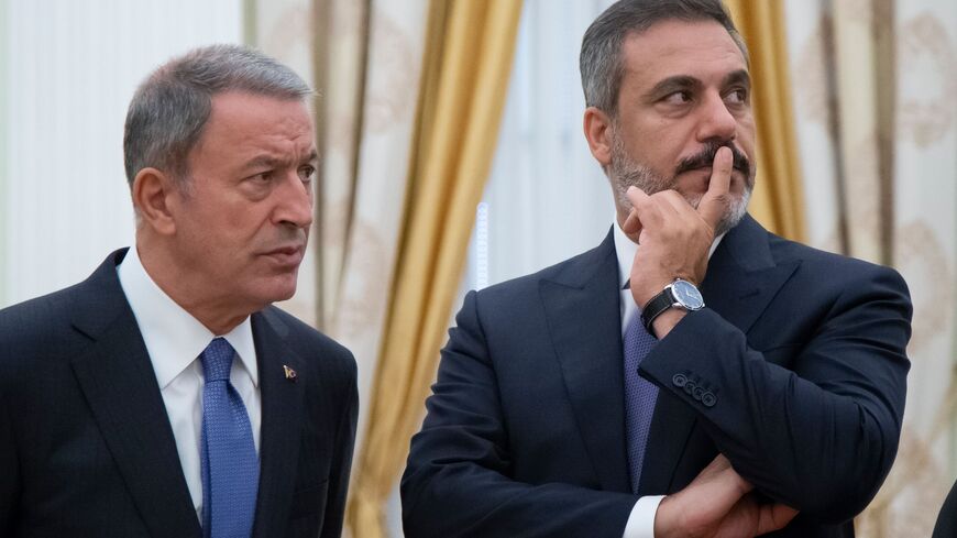 Turkish intelligence chief Hakan Fidan (R) and Turkish Defence Minister Hulusi Akar wait prior to a meeting with the Russian President at the Kremlin in Moscow on August 24, 2018. - Turkish Foreign Minister on August 24, 2018 warned that seeking a military solution in Syria's last rebel-held province of Idlib would lead to disaster, while Russian Foreign Minister Lavrov said that the situation was "multi-faceted" and called for separating out "the healthy opposition from terrorist structures." Idlib is one 