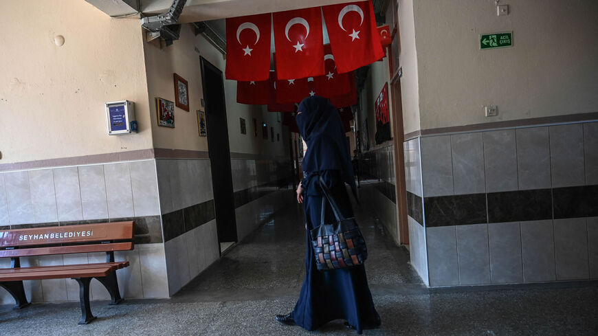 A woman walks in a hallway at Sehit Duran primary school in Adana, Turkey, March 18, 2019.