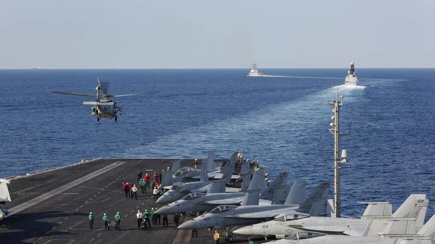 The aircraft carrier USS Abraham Lincoln (CVN 72) transits the Strait of Hormuz as an MH-60S Sea Hawk helicopter from the Nightdippers of Helicopter Sea Combat Squadron (HSC) 5 lifts off from the flight deck November 19, 2019. The Abraham Lincoln Carrier Strike Group is deployed to the U.S. 5th Fleet area of operations in support of naval operations to ensure maritime stability and security in the Central Region, connecting the Mediterranean and the Pacific through the western Indian Ocean and three strateg