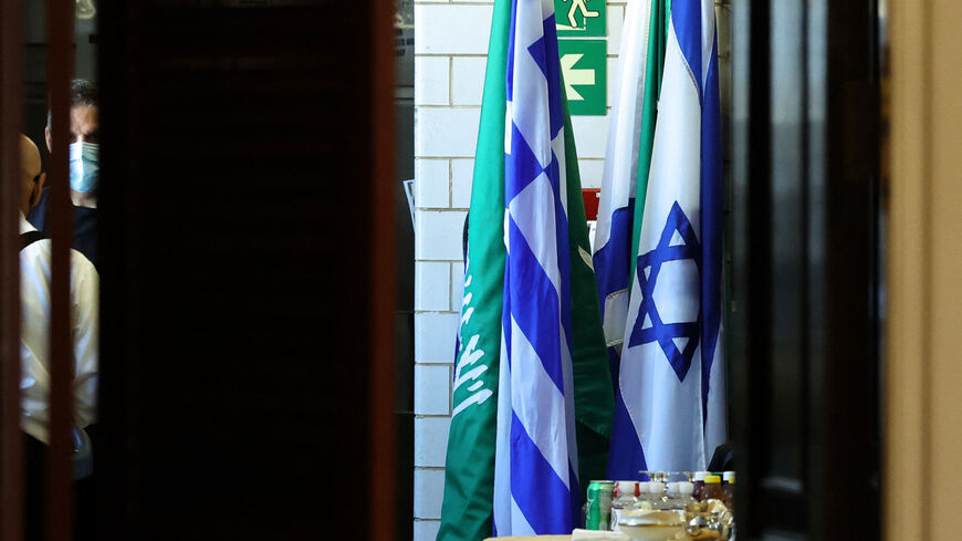 Flags of Saudi Arabia and Israel stand together in a kitchen staging area as US Secretary of State Antony Blinken holds meetings at the State Department in Washington, DC, October 14, 2021. (Photo by JONATHAN ERNST / POOL / AFP) (Photo by JONATHAN ERNST/POOL/AFP via Getty Images)