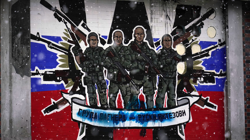 This picture shows a defaced mural to the glory of Russia's mercenary group Wagner reading "Wagner Group."