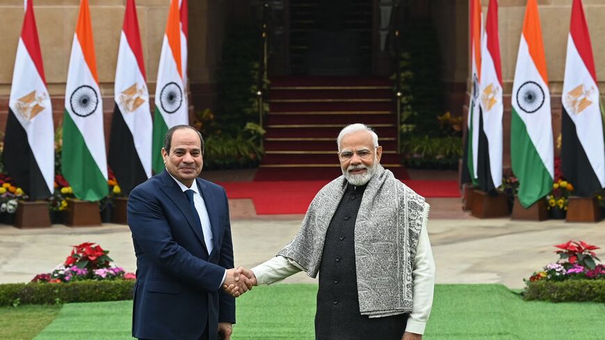 Egypts President Abdel Fattah al-Sisi (L) shakes hands with Indias Prime Minister Narendra Modi before their meeting at the Hyderabad House in New Delhi on January 25, 2023. (Photo by Sajjad HUSSAIN / AFP) (Photo by SAJJAD HUSSAIN/AFP via Getty Images)
