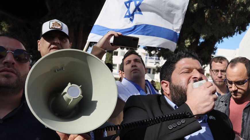Almog Cohen (R) of the far-right Otzma Yehudit (Jewish Power) and right wing activists demonstrate in support of the Israeli army operation in the West Bank city of Jenin, at the Tel Aviv University campus on Jan. 30, 2023.