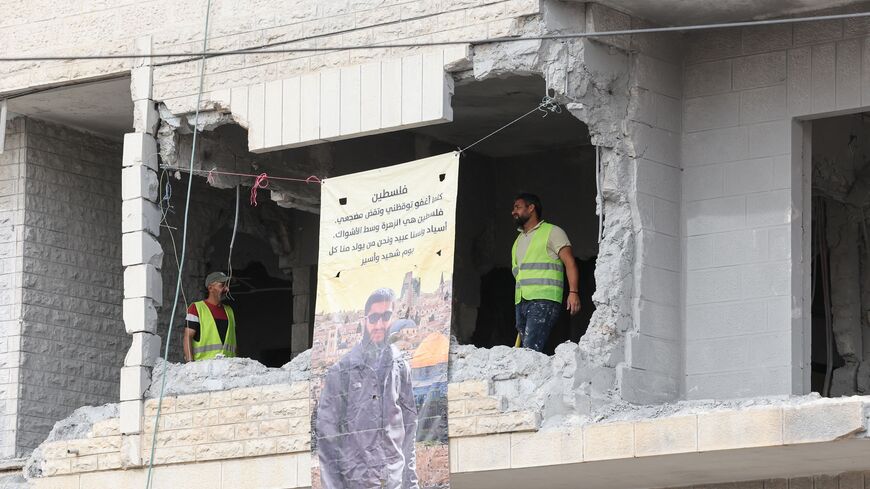  Palestinian municipality workers inspect the damage to the house of Islam Faroukh, a Palestinian charged for the Jerusalem twin bombings in November 2022 that killed two people, after it was demolished by Israeli forces in Ramallah in the occupied West Bank on June 8, 2023. (Photo by AHMAD GHARABLI / AFP) (Photo by AHMAD GHARABLI/AFP via Getty Images)