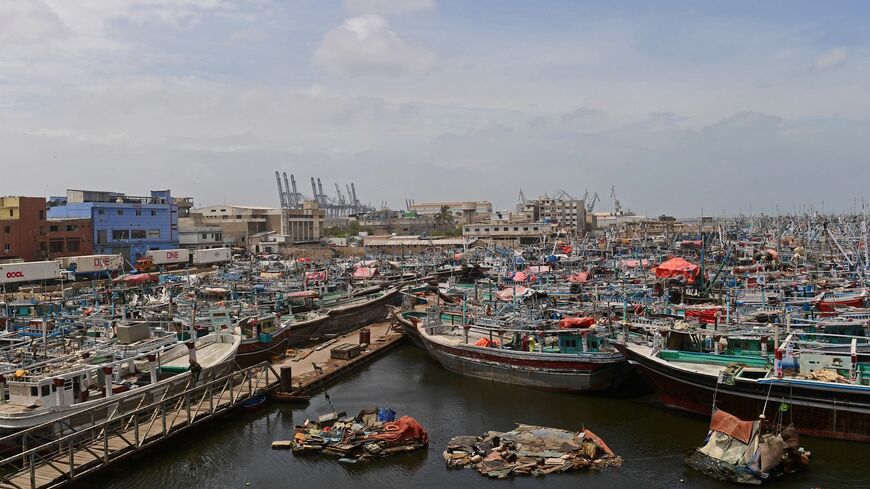 Fishing boats are moored at Karachi port as a part of precautionary measures before the due onset of cyclone, in Karachi on June 14, 2023. More than 40,000 people have been evacuated across India and Pakistan as a cyclone approaches their coast, officials said on June 13, with gales of up to 150 kilometres per hour predicted. (Photo by ASIF HASSAN / AFP) (Photo by ASIF HASSAN/AFP via Getty Images)