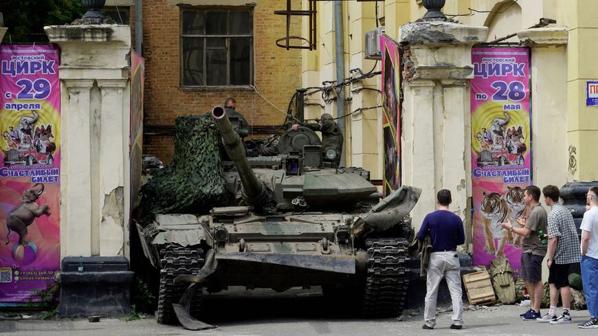 People look at a tank near a circus building in the city of Rostov-on-Don, on June 24, 2023. 