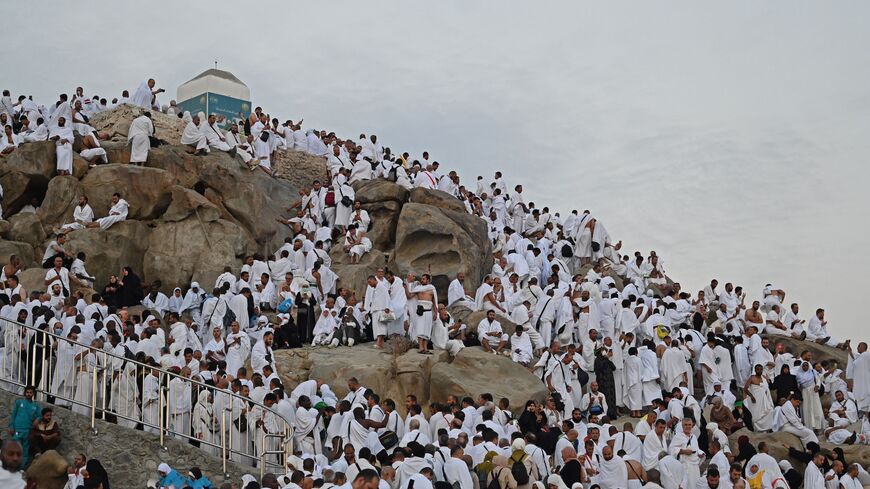 Muslim pilgrims crowd Saudi Arabia's Mount Arafat,also known as Jabal al-Rahma or Mount of Mercy, during the climax of the Hajj pilgrimage on June 27, 2023. The ritual is the high point of the annual pilgrimage, one of the five pillars of Islam, that officials say could be the biggest on record after three years of Covid restrictions. (Photo by Sajjad HUSSAIN / AFP) (Photo by SAJJAD HUSSAIN/AFP via Getty Images)