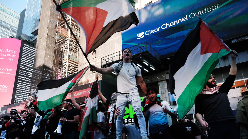 Pro-Palestinian protesters face off with a group of Israel supporters and police in a violent clash in Times Square, New York City, May 20, 2021.