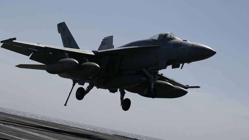A US F-18 Super Hornet lands on the flight deck of the USS Nimitz (CVN-68) during a South Korea and US combined maritime exercise as a part of Warrior Shield at sea on March 27, 2023 off the coast of South Korea. 