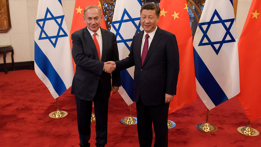 Chinese President Xi Jinping (R) and Israeli Prime Minister Benjamin Netanyahu (L) shake hands ahead of their talks at Diaoyutai State Guesthouse, Beijing, China, March 21, 2017.