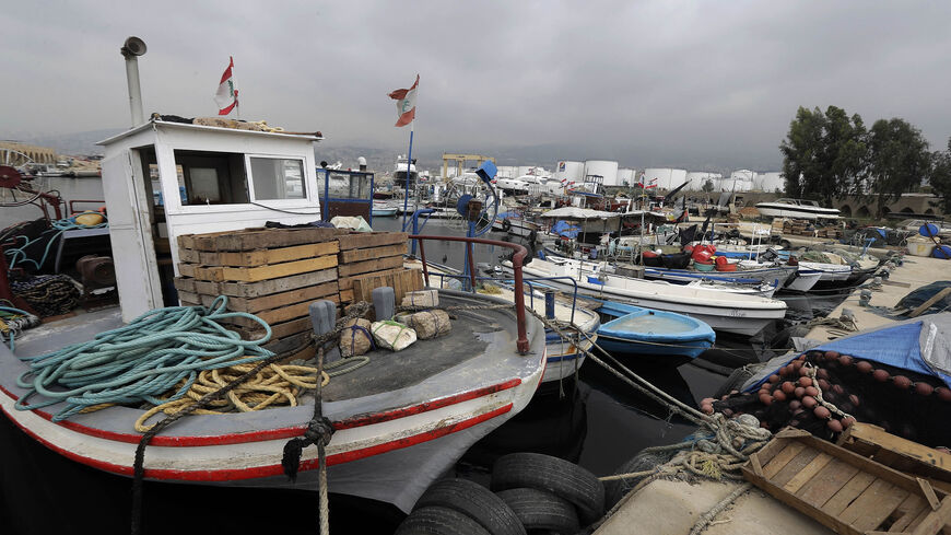 Fishing boats are moored at the port of Karantina, north of Beirut, as their owners protest against the continued use of the nearby Karantina landfill waste dump site and its resultant waste pollution harming the local fishing industry, May 24, 2018.