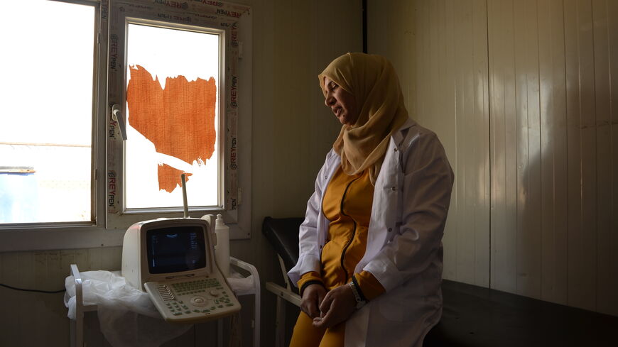 Yusra al-Ali in one of the examination cubicles at the Kurdish Red Crescent-run clinic in Abu Khashab.