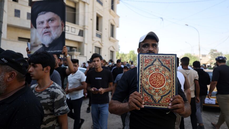 Supporters of Iraqi firebrand Shiite cleric Moqtada Sadr protest outside the Swedish embassy in Baghdad 