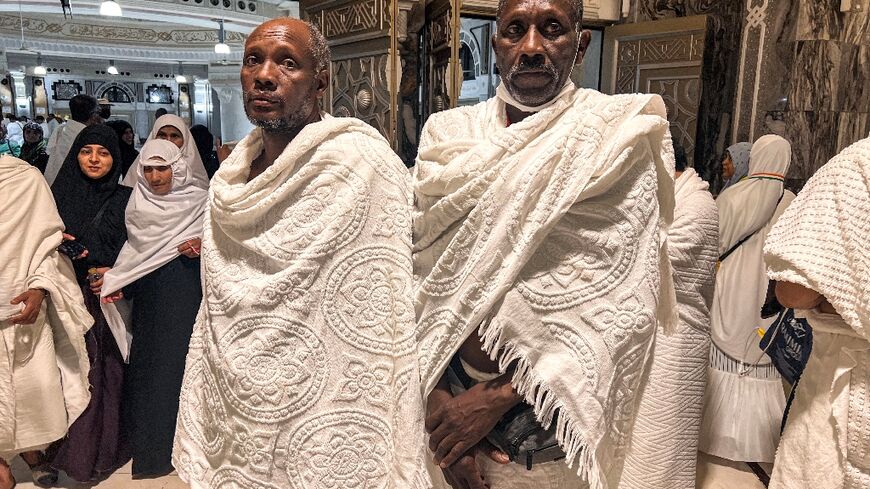 Kamal Kabashi (L) and Ahmed Jaber travelled for days from war-torn Sudan to Mecca to perform one of the five pillars of Islam