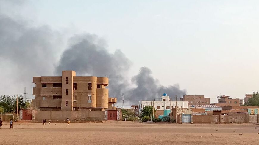 Smoke billows in the distance around the Khartoum North district amid ongoing fighting