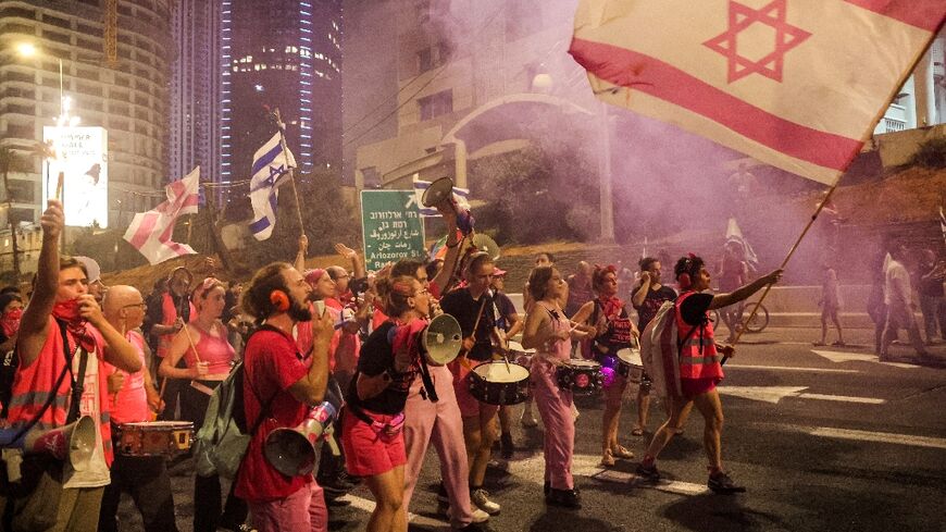 Demonstrators rally in Tel Aviv for the 27th straight week to protest the Israeli government's proposed judicial reforms