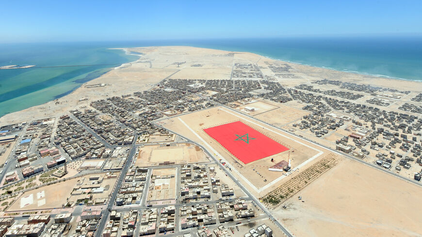 An aerial view shows a Moroccan flag measuring 60,000 square metres (645,835 square foot) and weighing 20 tonnes in the town of Dakhla, on May 8, 2010. The flag is an attempt to beat the record for the World's largest flag, a record which is currently held by Israel. AFP PHOTO/AIDA (Photo by AFP) (Photo by -/AFP via Getty Images)