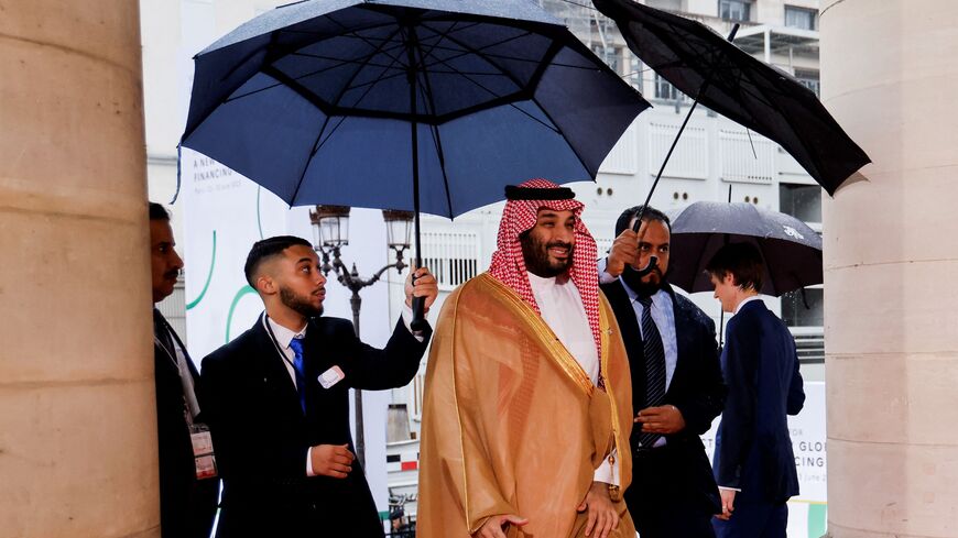 Saudi Crown Prince Mohammed bin Salman (C) arrives at the Palais Brongniart for the New Global Financial Pact Summit in Paris on June 22, 2023. Dozens of global leaders are gathering in Paris on June 22 for a summit to tease out a new consensus on international economic reforms to help debt-burdened developing countries face a growing onslaught of challenges, particularly climate change. (Photo by LUDOVIC MARIN / POOL / AFP) (Photo by LUDOVIC MARIN/POOL/AFP via Getty Images)