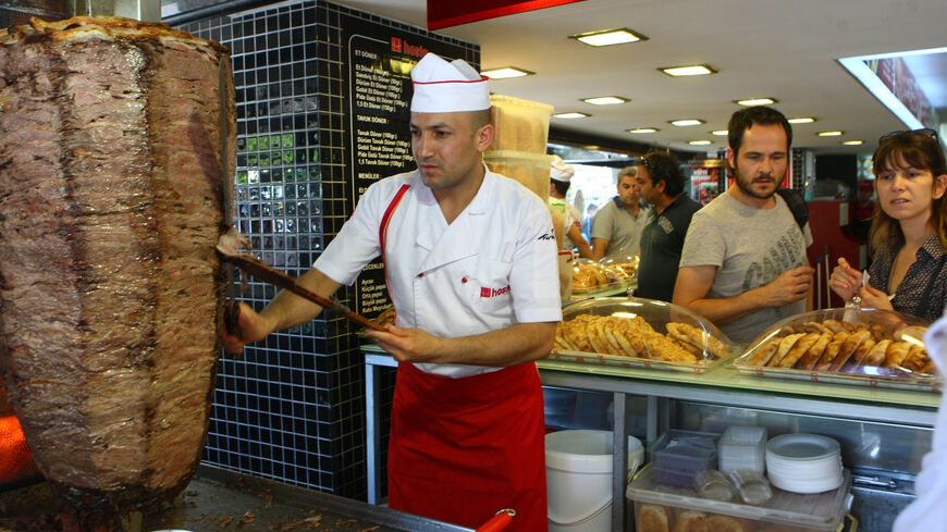 This photo taken on July 10, 2012, in Ankara shows people at a traditional "doner" fast food restaurant. In Turkey 35% of the population has accumulated excess body fat to the extent that it may have an adverse effect on health, leading to reduced life expectancy and/or increased health problems. The Turkish health ministry has launched a campaign calling on Turks to be more active. AFP PHOTO/ADEM ALTAN (Photo credit should read ADEM ALTAN/AFP/GettyImages)