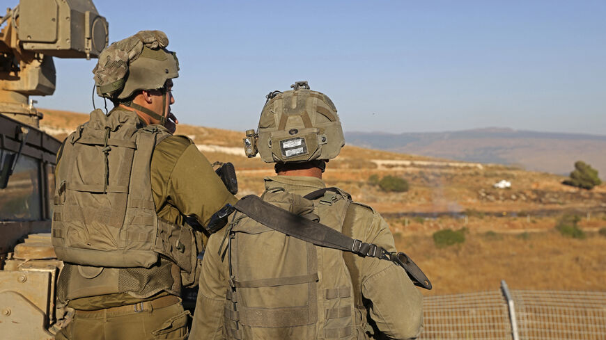Israeli soldiers take position along the border with Lebanon, in the town of Metulla in northern Israel, July 12, 2023.
