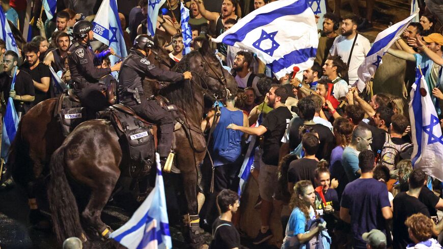 Demonstrators clash with Israeli riot police.