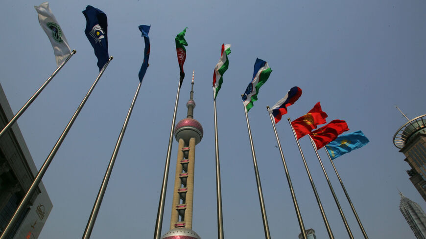 Flags of Shanghai Cooperation Organization member states fly in front of the Shanghai International Convention Center, where the SCO summit is held, Shanghai, China, June 11, 2006.