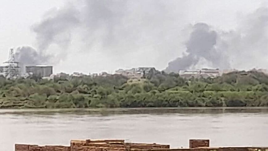 Smoke billows in the distance north of the Khartoum Bahri district amid ongoing fighting on July 14, 2023