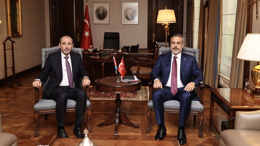 Jordanian Foreign Minsiter Ayman Safadi (L) meets with his Turkish counterpart Hakan Fidan in Ankara on July 4, 2023.