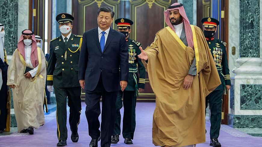 Saudi Crown Prince Mohammed bin Salman, right, welcomes Chinese President Xi Jinping.