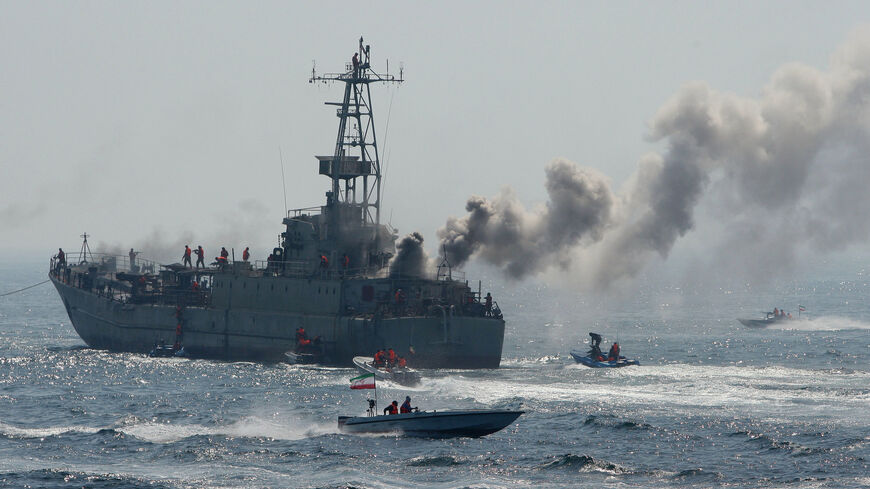 Members of Iran's elite Revolutionary Guard show their skills in attacking a naval vessel.